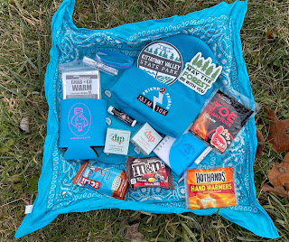 The race swag all laid out on a bandana.