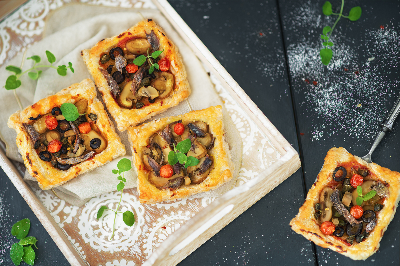 Rolled puff pastry with vegetables and anchovies