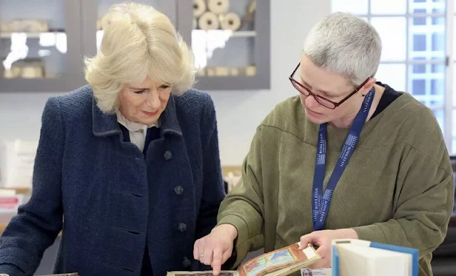 The Duchess of Cornwall wore a fit and flare ponte dress by ME+EM. The Duchess added a silk sash and funky gold earrings