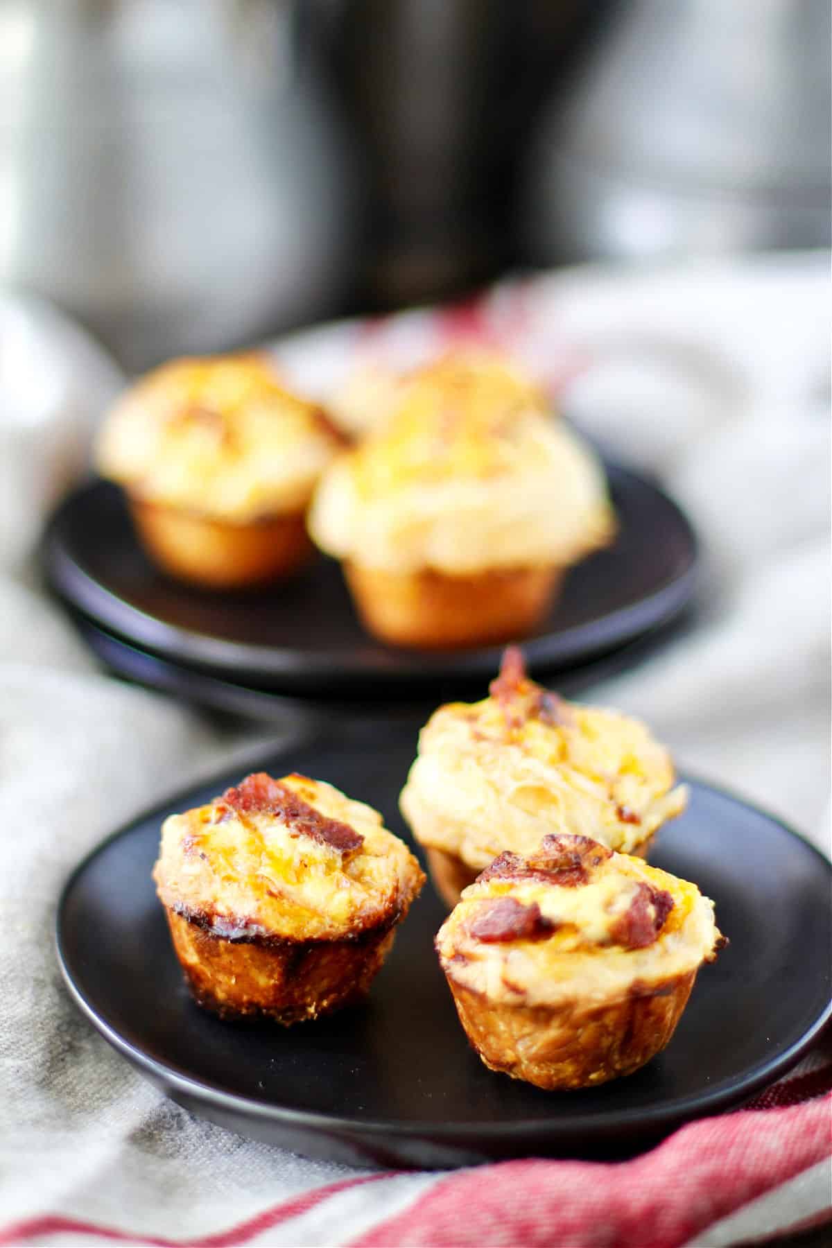 Bacon and Cheddar Mini Quiches on plates