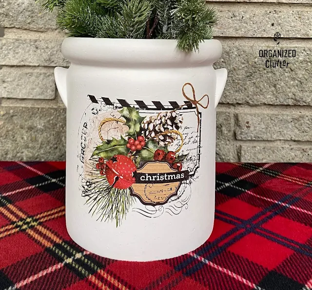 Photo of a painted painted utensil crock with a Christmas decor transfer.