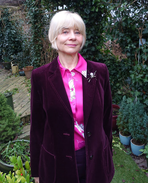 Over-50s blogger Gail Hanlon from Is This Mutton in thrifted velvet jacket, cerise print blouse and spider brooch from Etsy