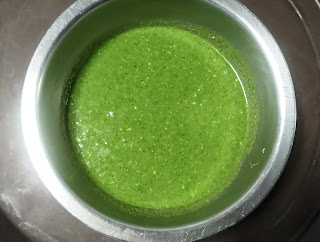 Green color pahadi kabab masala paste in a mixing bowl