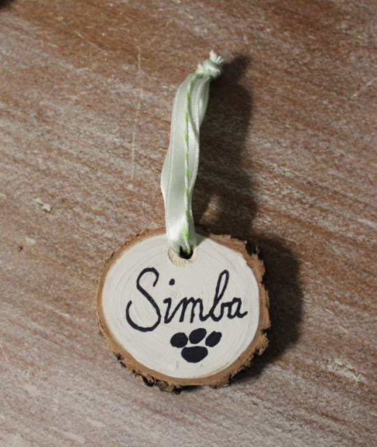 Photo of a wood slice pet Christmas ornament.