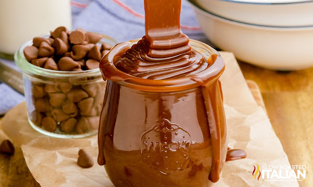 Hot Fudge Recipe pouring in a jar wide photo