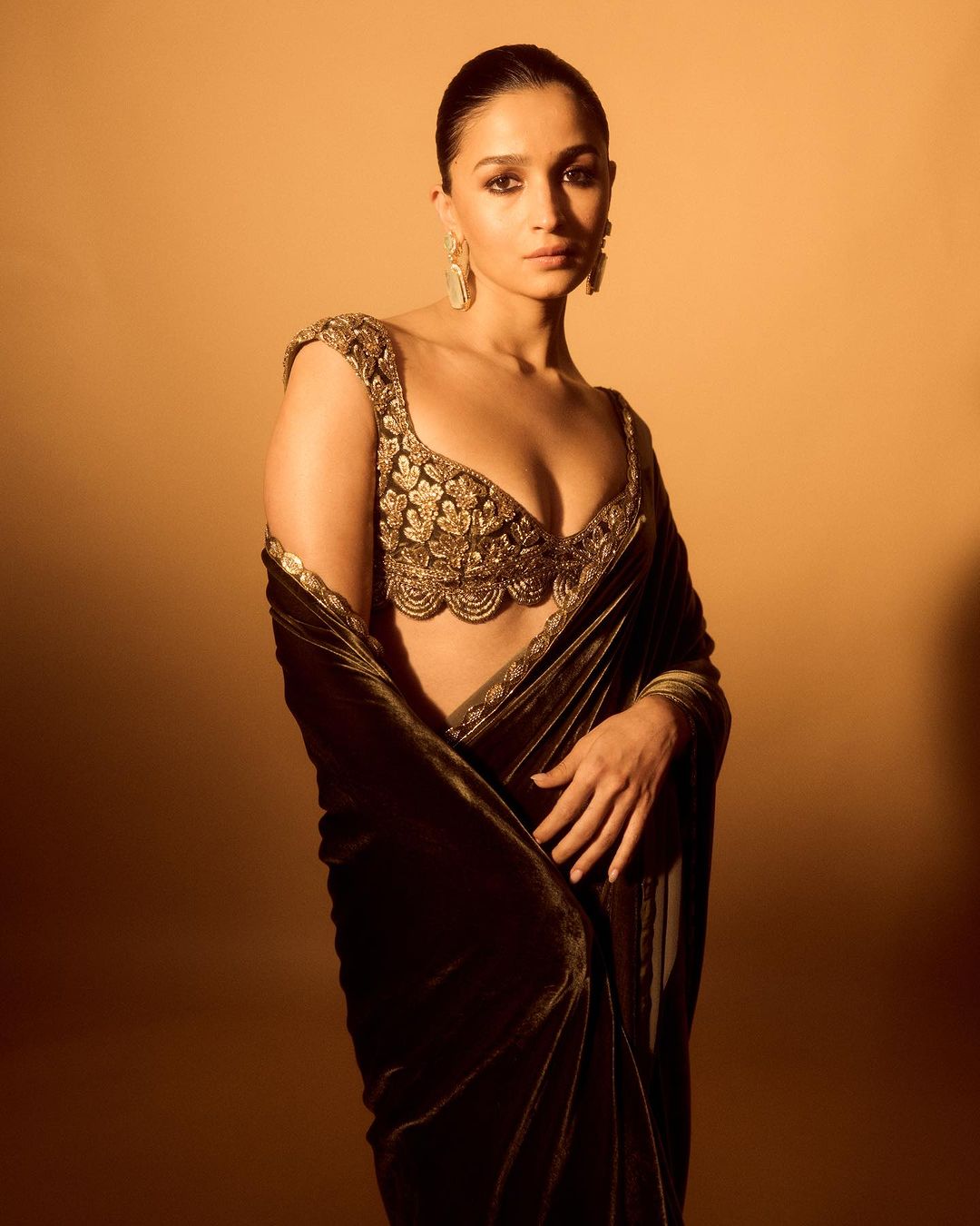 Alia Bhatt looks elegant in a Velvet Saree by Manish Malhotra paired with a Backless Blouse at the Zee Cine Awards 2024