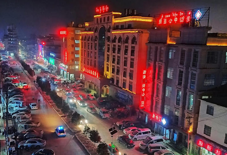 Neon glitters over a lawless border town where lives are bought and sold.