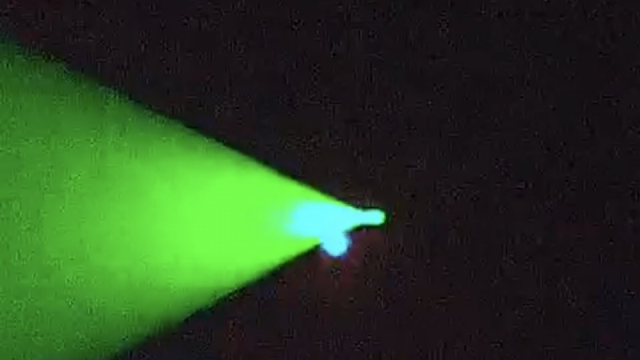 Green laser beam on UFO.