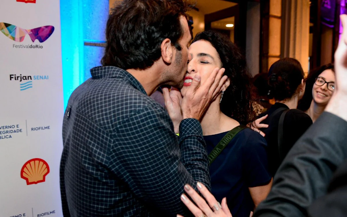 Marisa Monte troca beijos com o marido