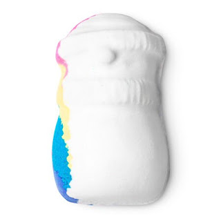 A white snowman shaped bath bomb with rainbow colours at the side ready to shoot out on a bright background