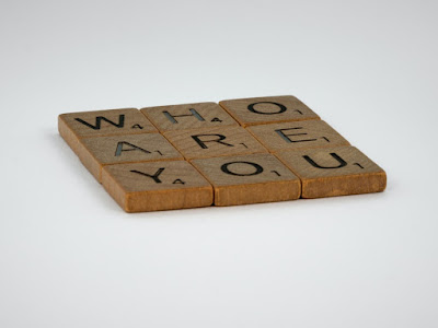 Image of word tiles, spelling out 'Who are you'