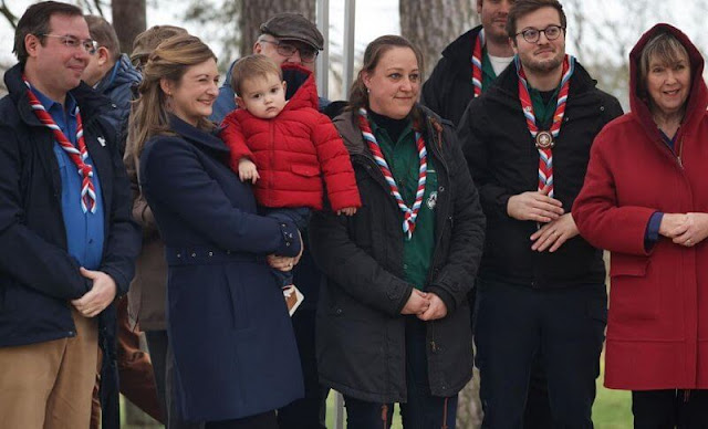 Princess Stephanie wore a blue Gibbsmoore coat by Burberry. Prince Charles wore a red puffer jacket by Petit Bateau