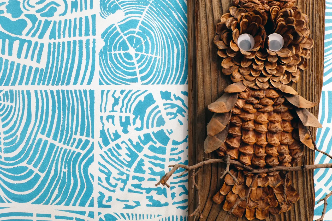 aqua stencil painted end cut wood with pine cone owl