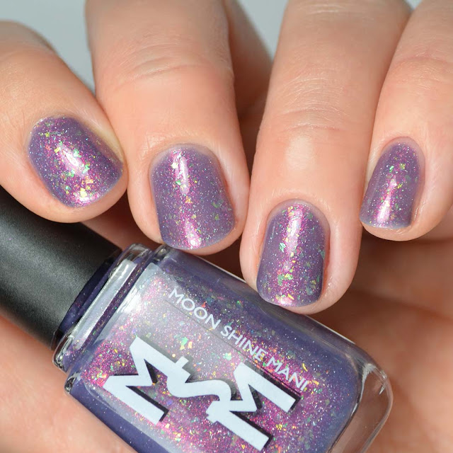 glowing purple nail polish with color shifting flakies swatch