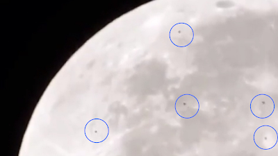 Here we can see many UFOs flying past the Moon.
