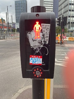 A pedestrian crossing sign.