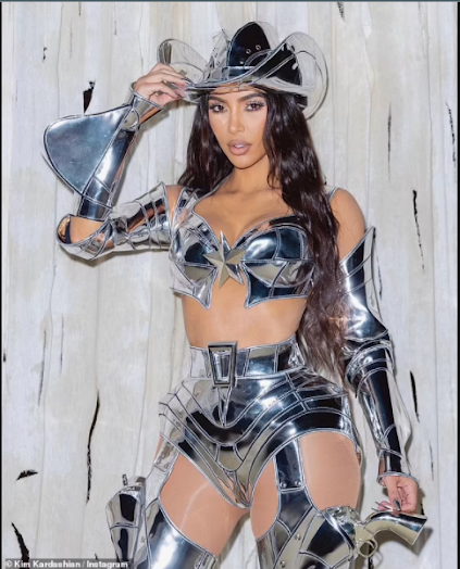 "Kim Kardashian stuns in metallic 'CowBot' costume complete with armor-like chaps and hat for Kendall Jenner's Halloween bash"