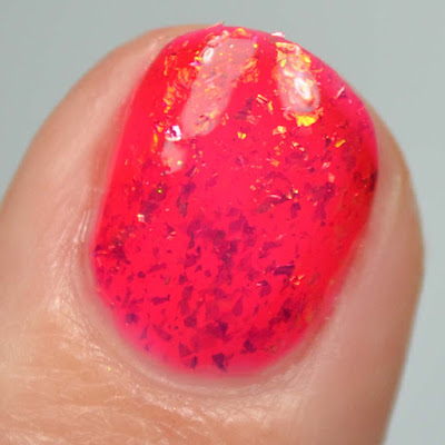 red jelly nail polish with flakies swatch