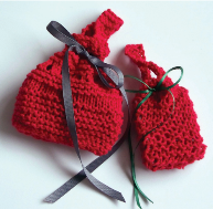 Image shows two knitted bags with ribbons threaded through them. Link opens in new tab.