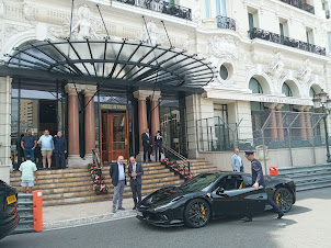 Ultra luxury cars arriving at Hotel de Paris.