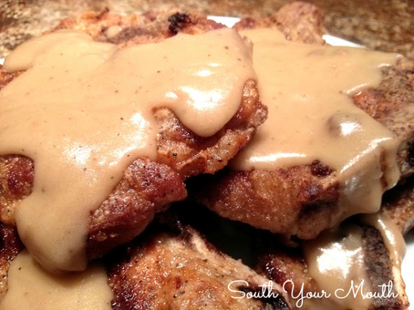 Fried Pork Chops & Country Gravy! A Southern-style recipe for perfectly cooked country fried pork chops with velvety homemade pan gravy.