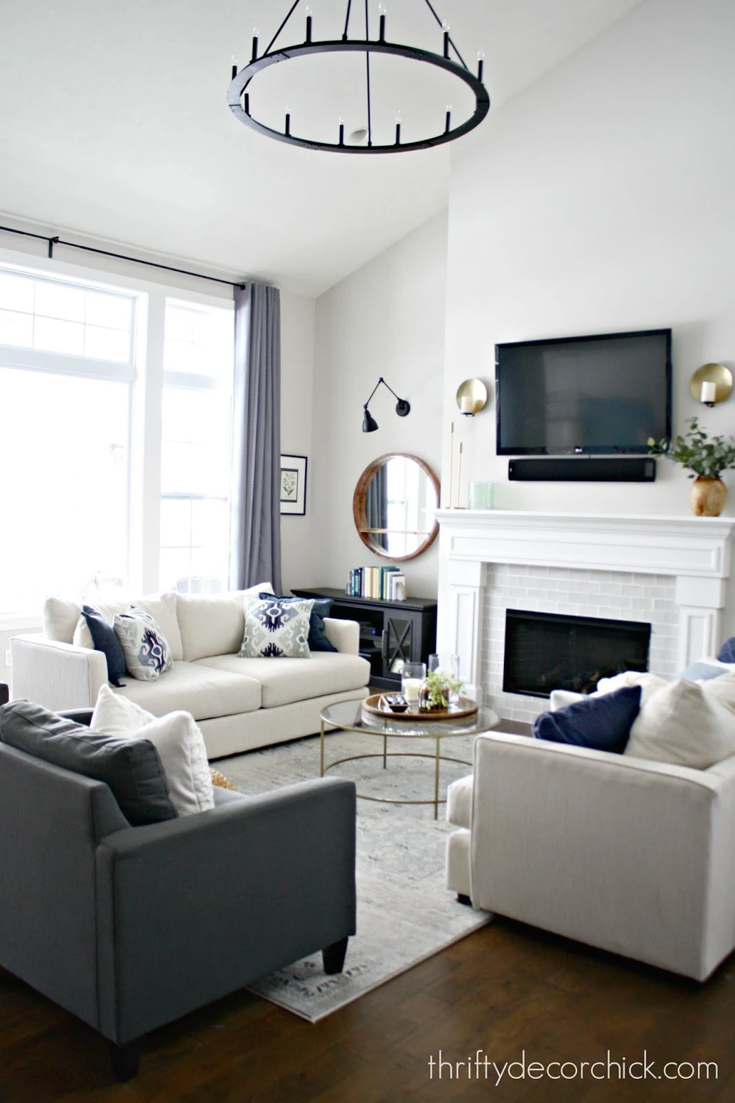 great room with tall ceilings and fireplace