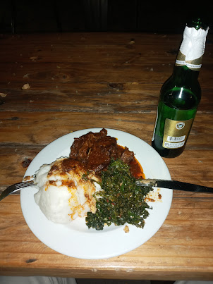 Local Zimbabwean dinner with Zambezi beer on "Amakhosi Night "