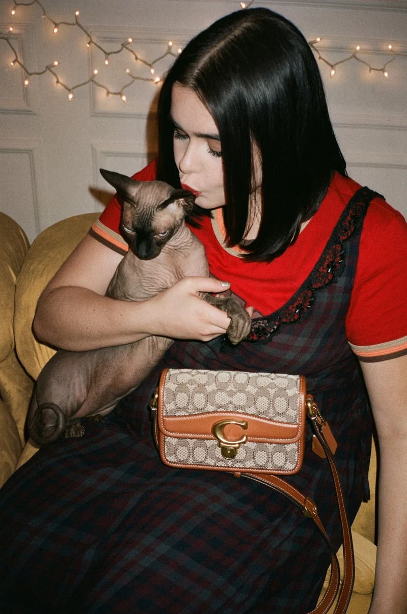 Barbie Ferreira stars alongside her cat Morty for Coach Holiday 2021 campaign. Photo: Courtesy of Coach