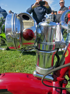 Carbide headlamp on vintage motorcycle.