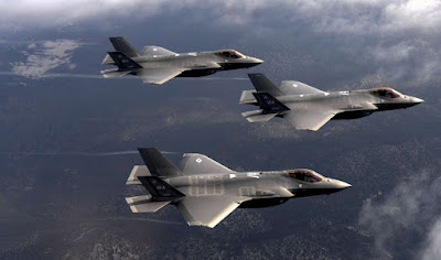 F-35 fighter jets escort military aircraft carrying military equipment to Ukraine