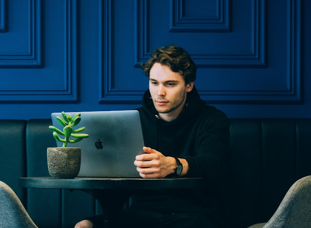 Man working on their own laptop