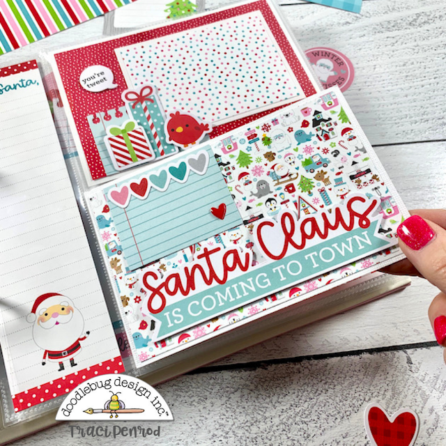 8x8 Christmas scrapbook page layout with Santa, gifts, and a folding card for extra photos