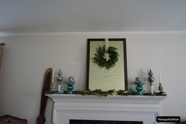 Christmas mantel with candlesticks and wreath