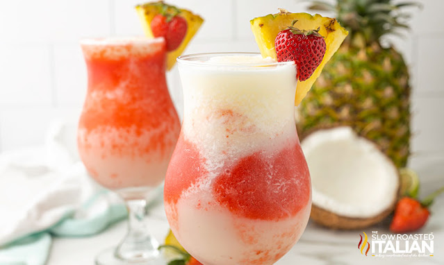 cocktails with pineapple and strawberry garnish