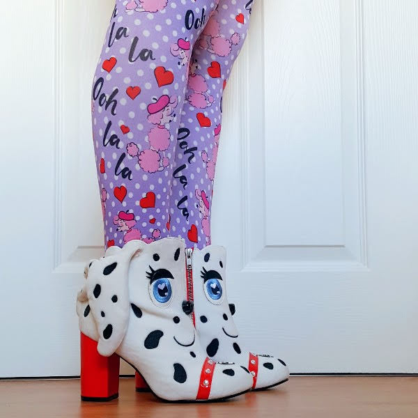 wearing white Dalmatian ankle boots with colourful poodle print tights