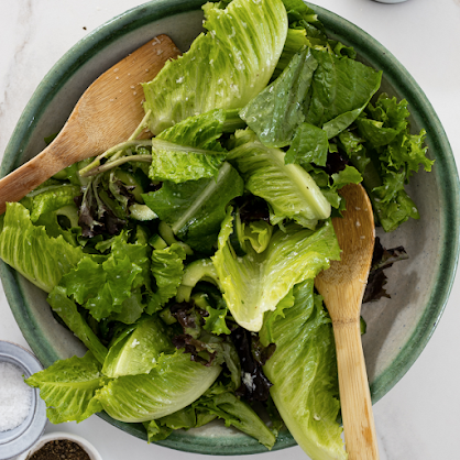 A salad bowl full of mixed greens