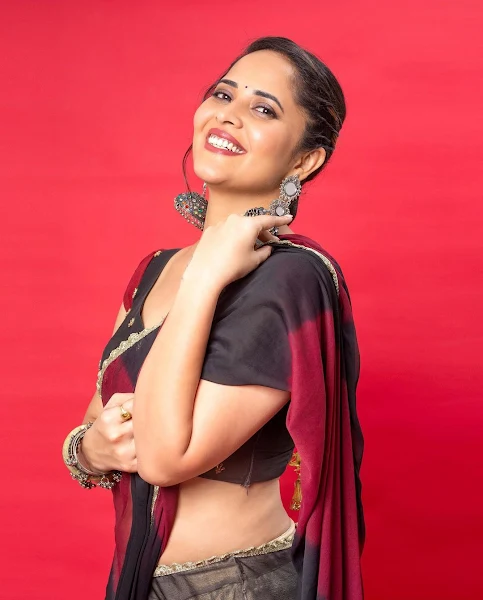 Anasuya Bharadwaj pretty in transparent half saree