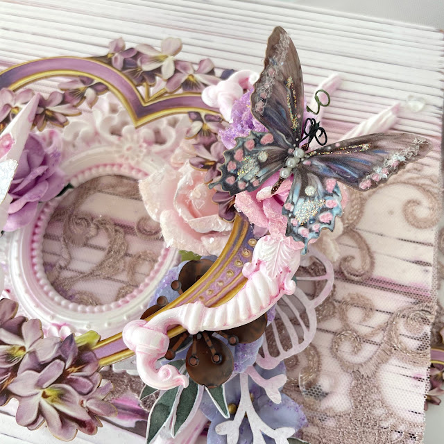 Mixed media canvas made with: Reneabouquets printed beautiful board lavender heart frame, shabby chic butterflies, tiny treasures sweet pea lavender butterflies, beautiful beads hearts of glass, gawdie girl glitter glass; Prima Marketing Watercolor floral paper flowers, ephemera, moulds; Tim Holtz distress oxide spray and paints; lace