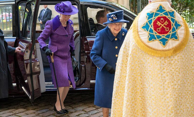 The Queen wore a navy blue coat, with a patterned dress. Queen Mary's Russian sapphire and diamond brooch