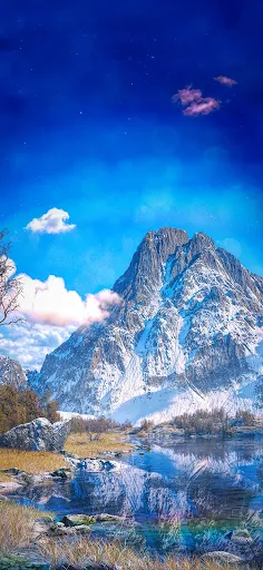 Snow-capped peak reflecting in clear waters