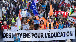 A "painful blow" to Macron ahead of the elections Why are the strikes paralyzing France's education?  Since the middle of the week, France has been experiencing a general strike in the education sector, with half of the country's schools completely suspended and tens of thousands of protesting teachers swarming its streets, in another painful blow to Macron's government less than 90 days before the presidential elections.  Less than 90 days away from a presidential election in which the French president hopes to win a second term, the streets of Paris refused to confirm once again the failure of the Macron government's policies in managing social files, especially as the country is reeling under the weight of the epidemic and its horrific economic effects.  This is how the French capital, and other cities in the country, re-enacted the scenes of labor strikes at the end of 2019, this time led by education sector workers who went to protest, declaring a general strike that completely disrupted half of French schools.  While their demands centered on providing an effective policy to confront the large spread of cases of corona infection among students, after the confusion in which the ministry responsible for the sector fell in this regard, in order to protect the educational staff as well as teachers, and to ensure the continuation of the learning path correctly after it was disrupted by the measures to combat the epidemic in schools.  Spark start The spark for the strikes was due to the decisions adopted by the French Education Minister, Michel Blanqui, who insisted that schools remain open at a time when the country is witnessing record numbers of infection caused by the spread of the Omicron mutant. This is with the assignment of teachers and school nurses to ensure the safety of students before entering lessons, in a strenuous process that takes place without providing them with protective equipment.  In a statement to the public opinion , a union of seven unions, comprising the category of education workers, announced its rejection of the measures, condemning “the unilateral decision of the minister, which was taken without the participation of workers in taking it to keep schools open,” without providing the necessary protections for workers or the human resources necessary to complete those measures. ".  The unions' statement added, "This situation has thrown the schools into a state of chaos, which would negatively affect the learning process of the teachers." He stressed that "during the school closure period, we maintained the continuity of the academic path, but by doing these measures, we are facing intermittently."  This prompted the unions to declare a general strike in which more than 75% of the education workers participated, and as a result, half of the country's schools were disrupted, what the media described as "historic" due to the extent of participation in it. As well as the call for a national disembarkation of tens of thousands of workers to participate in a protest march that was held in the streets of Paris on Thursday, January 13th.  In response to this, the French Minister of Education rushed in an attempt to calm the anger, as he later announced the distribution of 5 million FPP2 protective masks, as well as the appointment of 3,300 additional contractors to compensate for the absence of teachers who were injured, in contact with or who had to care for their sick children. While the unions are still insisting on their demand to abolish the new procedures, and to return to the old protocol, where classrooms were closed if injuries were discovered, and the distance education process continued.  The situation of "hell" in the French school "We are despised, exploited, for low wages; that is why we protest!" With these words, French teachers described the situation in which they are living as a result of the Macron government's policies in the Gaza Strip.  In a testimony carried by Médiapart from the protests, one protester described the chaos in the French school, saying: "Children are sick, teachers are sick as well, and parents in this situation live on their nerves. We live in a climate of constant tension."  Another testimonial adds: "No, the school doors are not open, as Michel Blanqui promotes. I teach only five students in the morning, eleven in the evening, and twenty the next. Between this and that I had to work from two to three hours. Additional fees for those who were absent to keep up with the educational process.  Another says: "We feel like scapegoats for the Macron government's policies, with the children of the nursery school, where the epidemic moves freely among children who are exempt from wearing protective masks."  In another reportage for Le Monde newspaper, the principal of a school in Cergy (north of Paris) describes the situation in his institution as "hell". 140 out of 250 students are absent from classrooms, and teachers spend at least four hours each day, in harsh weather conditions, to check on students' safety before entering school.  Only during the first week of January this year, more than 5,631 teachers and 47.5 thousand students were infected with Corona, and more than 9,202 classrooms were closed as a result, according to the statistics of the French Ministry of Education.  A blow to Macron A strike by French education workers is a major blow to President Emmanuel Macron, less than 90 days away from the presidential election. "No one in the head of state expected a national strike by teachers and education workers, and no one imagined the turnout he knew," confirms a report in Le Monde newspaper.  He added that it was "the most embarrassing event (for Macron's government) less than 90 days before the first round of the presidential election, where it was not expected that the representatives of parents would join the discontent of teachers in the face of a health protocol, which is a development that is too heavy, too complex, too fast." .  On the other hand, observers believe that the event represented a golden opportunity for Macron's rivals to pounce on him, and even threaten to completely finish off his ambitions for a second term. This is what we notice through the actions of those competitors, led by the leader of "Proud France", Jean-Luc Melenchon, who accused Blanqui of seeking to "destroy the French school". And he called on the Greens candidate, Yannick Gaddo, to "stop abusing teachers."  On the right, an adviser to the GOP candidate, Damien Abad, blamed the education minister for "the great chaos inside the French school". He also criticized Emmanuel Macron's state balance sheet, saying: "He has failed to make education a vehicle for social advancement. Today equal opportunity is a sham and social progress is an illusion."