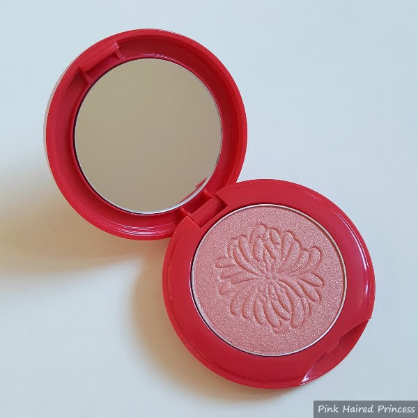 open compact with mirror inside and Paul & Joe Shimmering Blush 001