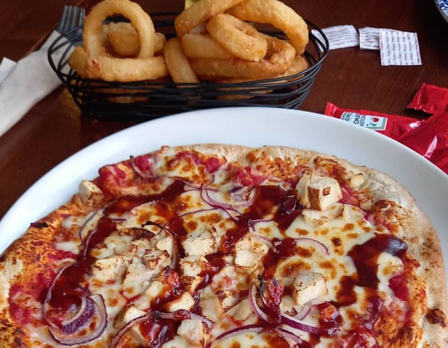 BBQ chicken pizza and onion rings
