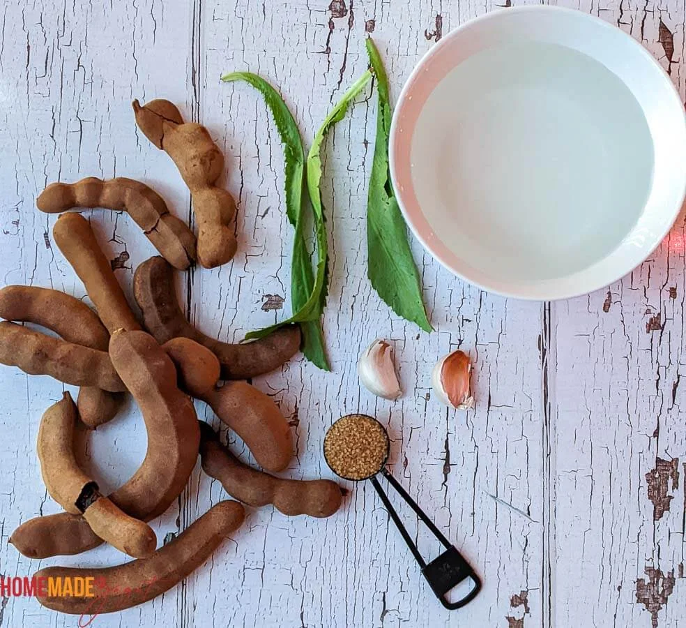 This is a picture of the ingredients to make tamarind chutney. Placed on white board