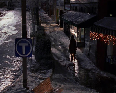 Joey walking alone down a street