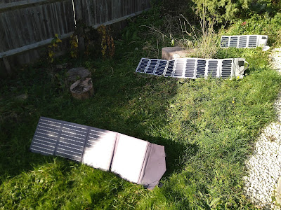 Three sets of solar panels arranged in the garden