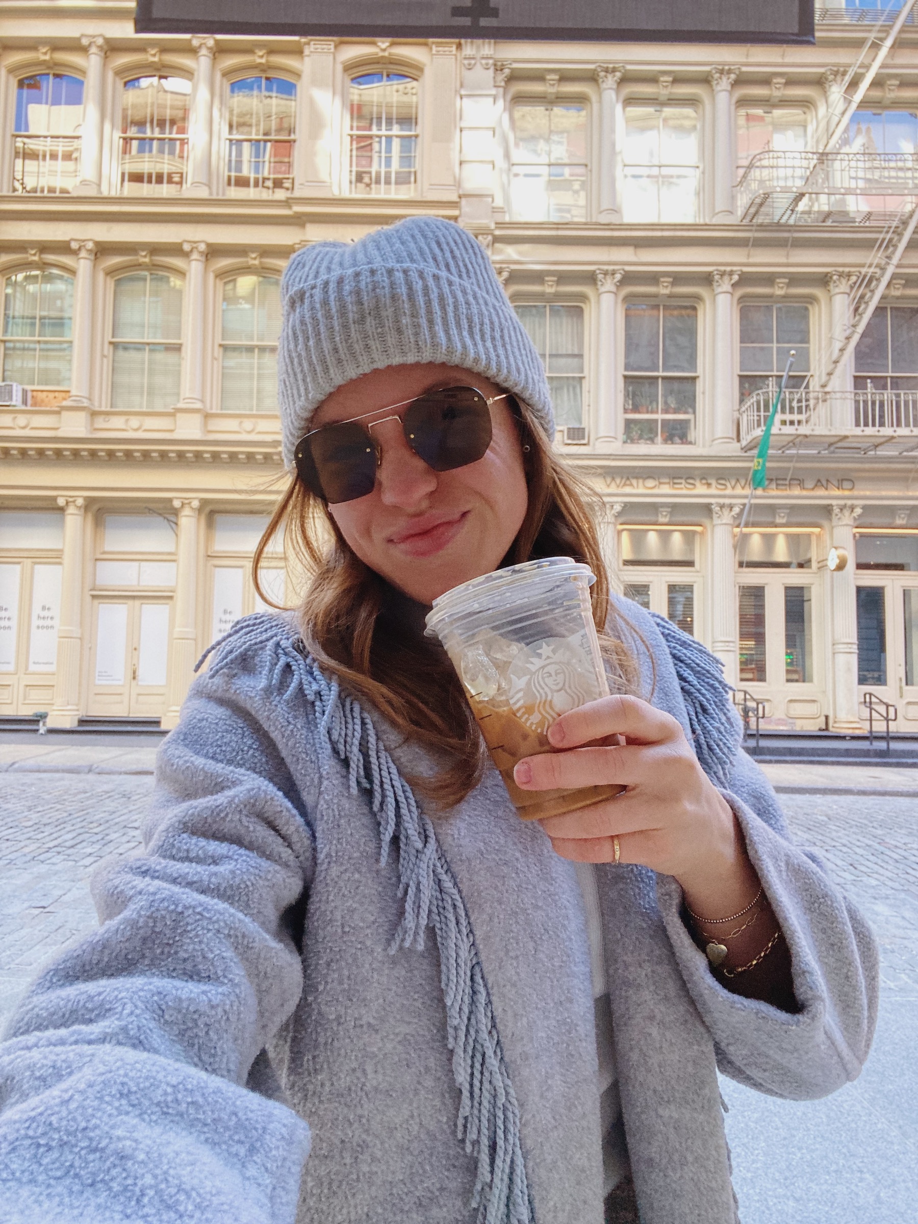 this week's top 10 fran acciardo march 2022 fringe coat grey beanie starbucks