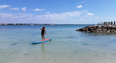 woman on paddle board on the sea