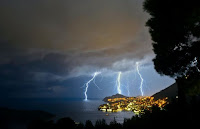 Lightning over city - Photo by Stefano Zocca on Unsplash