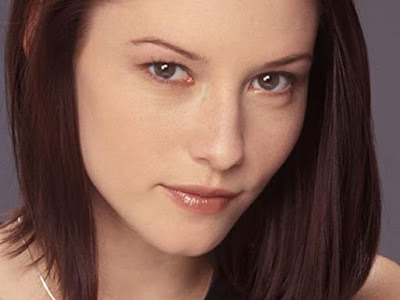 Chyler Leigh giving the camera a gimlet eyed knowing smile